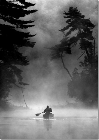 canoeing down river in fog