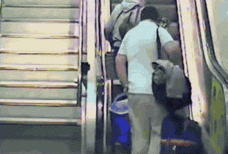 funny-gif-escalator-fall-bags-laying-down