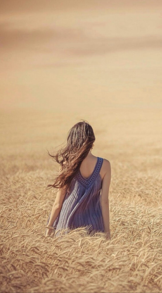 wind-wheat-back-woman-portrait